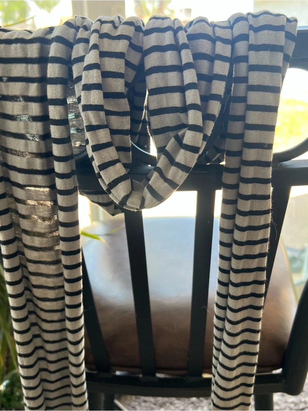 Eight scarves of various colors and styles